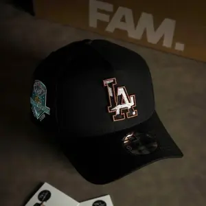 New Era 9FORTY LA Dodgers Cap For Men And Women – Adjustable Black Baseball Hat with Bronze Outline Logo & Special Anniversary Patch Snapback