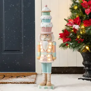 Glitzhome 28"H Lighted Macaron Pink and Blue Resin Christmas Cupcake Nutcracker Porch Decor w/Timer