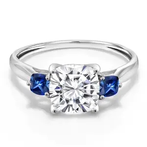 Gem Stone King 10K White Gold White Moissanite and Blue Created Sapphire 3-Stone Engagement Ring For Women | 1.96 Cttw | Cushion 7MM | Gemstone Birthstone | Available In Size 5, 6, 7, 8, 9