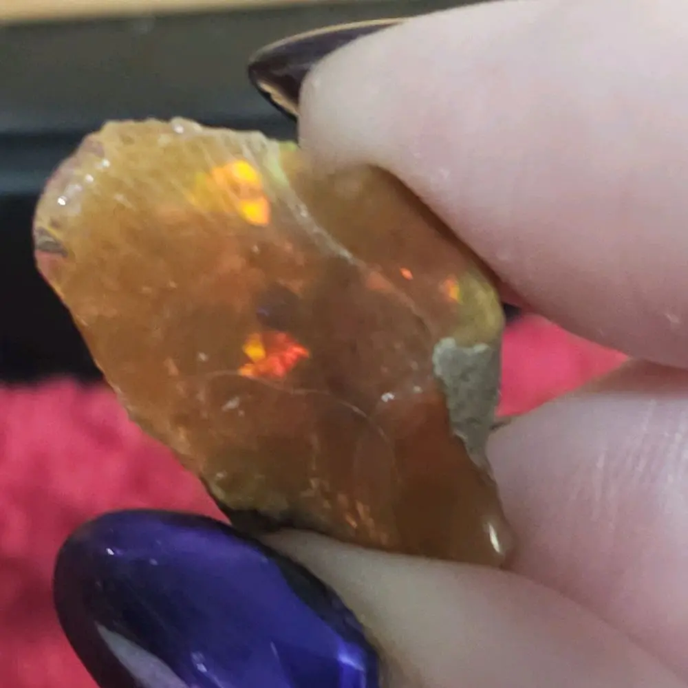 Fire Opal 50 Carats Honey Fire Opal with Red-Gold Flash 23.1 × 15.6 × 9.1 mm Semi-Transparent Warm Golden-Honey Base Vibrant Play-of-Color Ideal for Freeform Cabochon