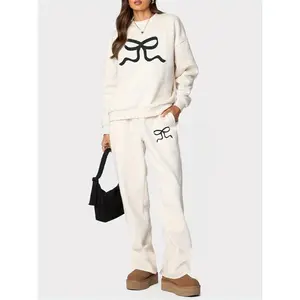 Women’s pants set featuring a bow print: long-sleeve crew-neck hoodie and sweatpants activewear set made from polyester fabric with pockets