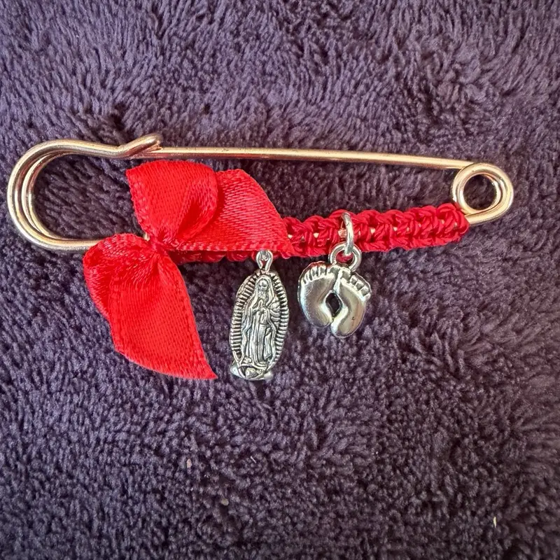 Pregnancy protection pin with virgin of Guadalupe and baby feet