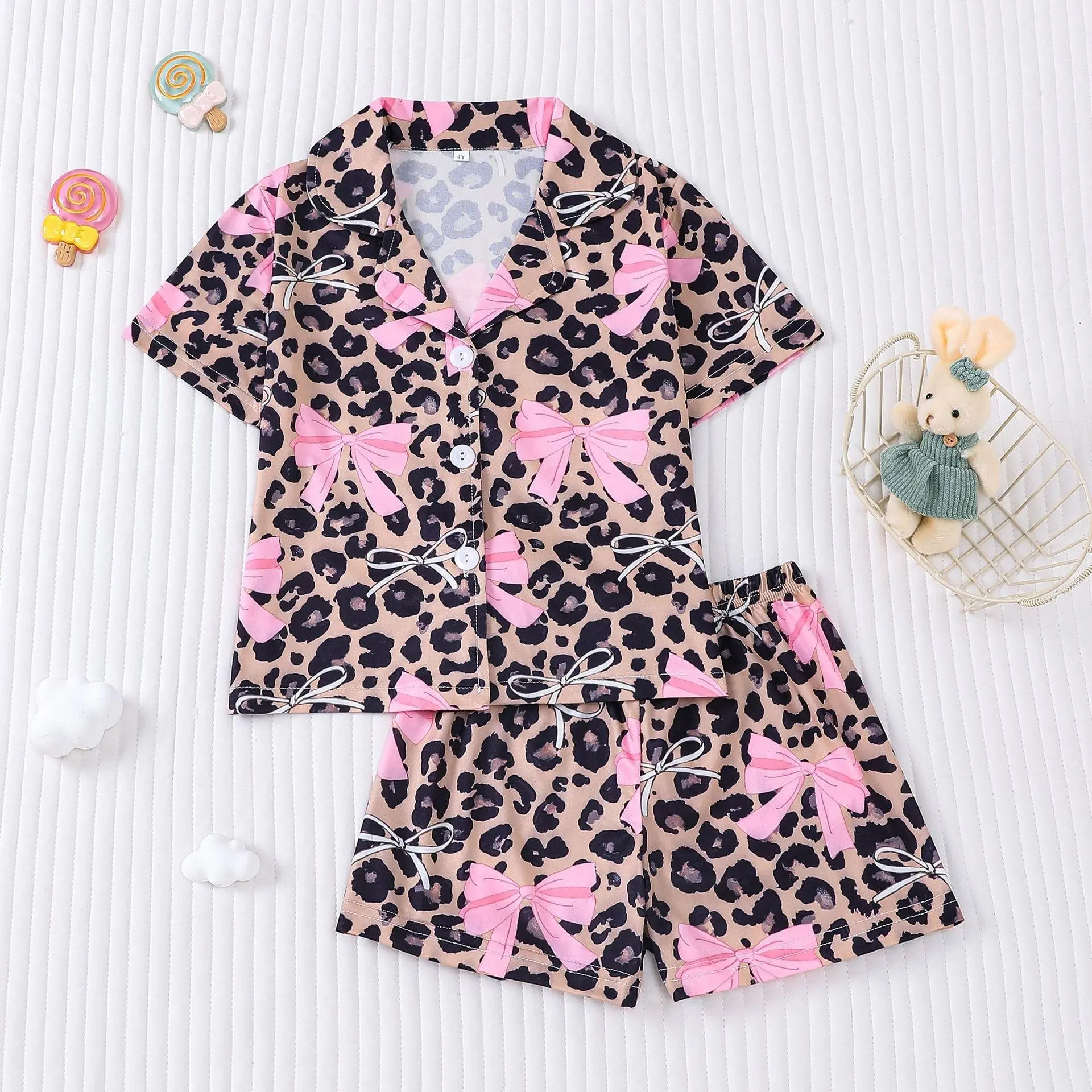 Children's two-piece pajama set, comfortable summer pajamas kids, sweet and cute leopard print with bow decorations, cardigan-style short-sleeve top paired with shorts, suitable both boys and girls, ideal everyday wear