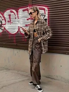 A women's brown plaid shirt with a turned-down collar and single-row buttons, suitable for spring and autumn, suitable for daily street wear and wear.