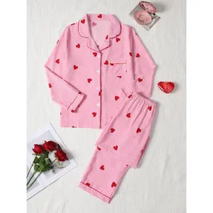 Women’s Valentine’s Day sleepwear set featuring a bubble-pleated, heart-printed design; a long-sleeved top with a front button closure and elastic-waist pants; casual loungewear GARMENTARY