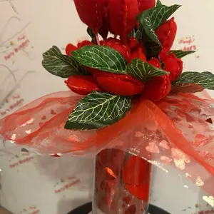 Beautiful Handmade Felt Hearts Bouquet with Green Leaves, and a cute detail on the bottom of a glass vase with printed heart and love word. Decorative Decor Ornaments