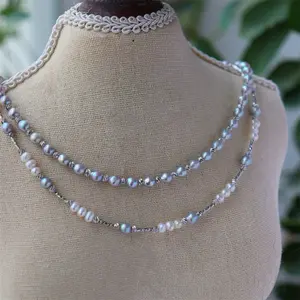 Ocean Mist Pearl Necklace - Elegant Design with Pearl Accents and Chain Details