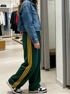 A pair of yellow striped drawstring wide-leg trousers, Womenswear, on the side of women's clothing, casual underwear, suitable for daily commuting, spring and summer vacations