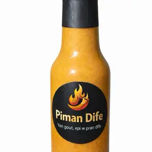 Piman dife.yon gou yon dife  Fèt ak piman natirèl	 Gou tradisyonèl ayisyen 	•	 Bon pou diri, poul, griyo, fritay. Haitian Hot Pepper Sauce