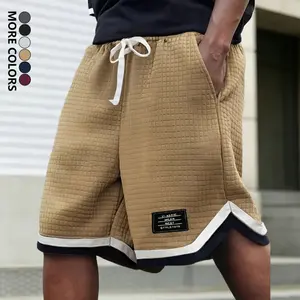 Men’s plus-size shorts with a waffle texture, knit design featuring contrasting stripes and label patterns, drawstring and pockets—classic, stylish, breathable shorts suitable for everyday summer wear and streetwear.