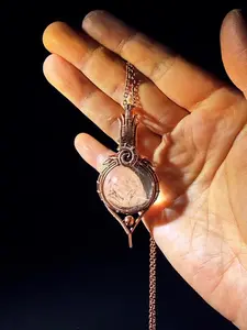 A necklace handwoven from copper wire.