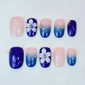 Short oval-shaped island wearing manicured nails made by hand in a pure blue three-dimensional floral design, Flower Nails, Stick On Nails