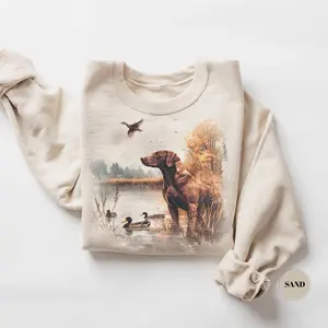 Duck Hunting Dog Graphic Sweatshirt Retriever in Marsh Wildlife Scene Waterfowl Hunting Gift for Hunters Outdoor Lovers Unisex Crewneck Pullover