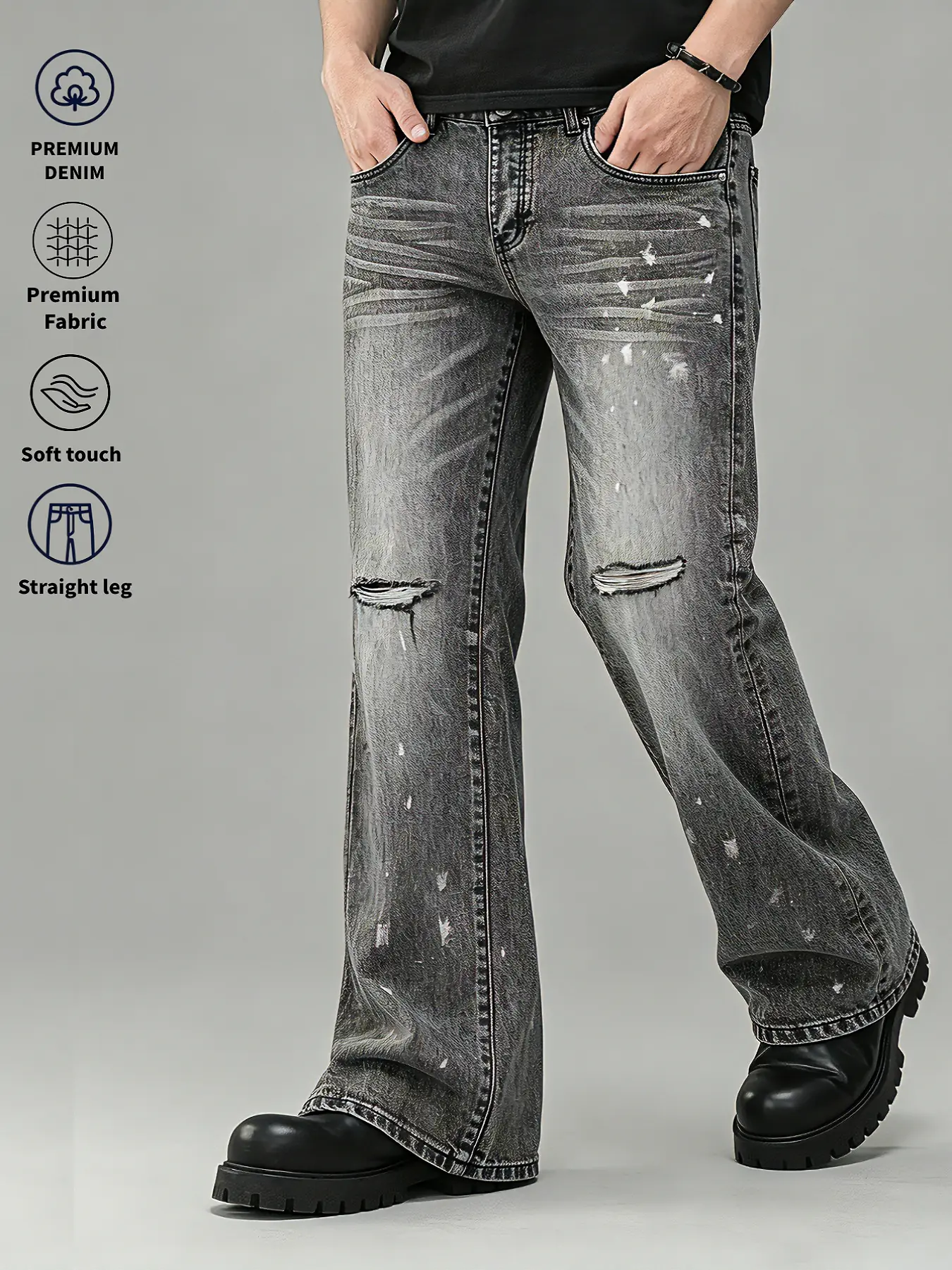 Vintage distressed men’s denim jeans pants with a slight flare, white paint splatter design, and a drapey feel