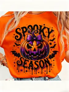 Festive Orange 100% Cotton Women's Short Sleeve T-Shirt with Spooky Season Pumpkin Bat Graphic Ideal for Halloween Parades Costume Parties and Fall - themed Events