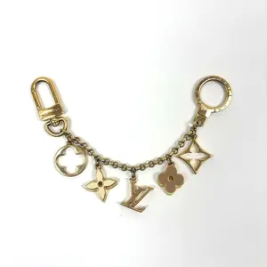 Pre-owned Louis Vuitton metals Bag Accessories Keychain Multiple Charms, Gold Tone Finish, Stylish Versatile Bag Accessory for Personalization & Fashion