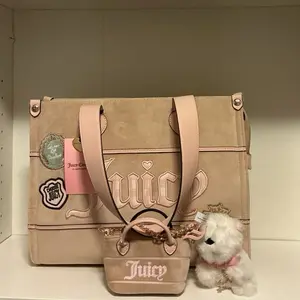 Juicy Couture Study in Style Women's Tote Bag - Buff Beige, Gold Hardware, Bag Charms, Foldable, and Lightweight.
