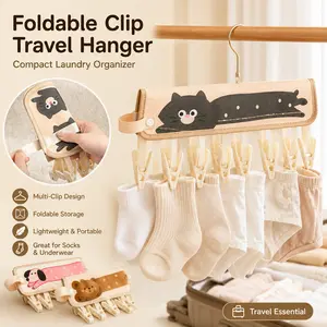 Fabric Folding Clothes Hanger with Clips, ultra-portable travel laundry organizer. Compact foldable design for hanging underwear, socks and small garments, perfect for hotels, trips and outdoor use, lightweight travel essential.