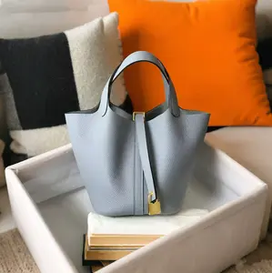 Daily use bag for women: vegan handbag, women’s bucket bag with top design. Handbag/shoulder bag with detachable small compartments, yellow/brown color #Minimalist essentials for daily use. unique mother