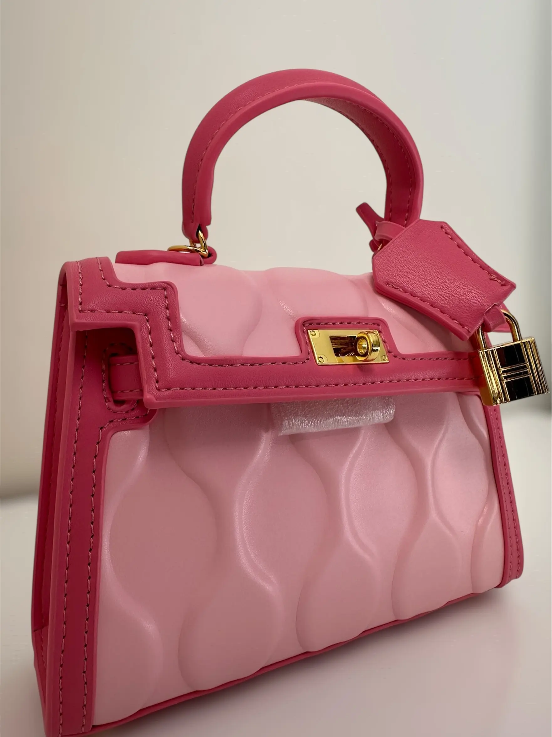 The Pink Muse - Pink Handbag with Unique Design and Gold Lock Detailing