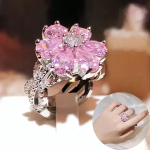 Fashionable silver-plated ring with cherry blossom design and pink Zirconia stones, suitable as a gift for engagements, weddings, anniversaries, parties, or everyday wear.