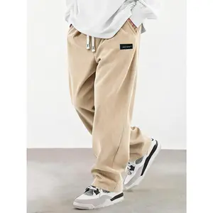 Men's Spring/Autumn Corduroy Casual Long Pants, solid color with drawstring pockets. Lightweight, soft, breathable, and comfortable. Wide-leg straight fit with elastic waist; highly versatile for daily casual outings.
