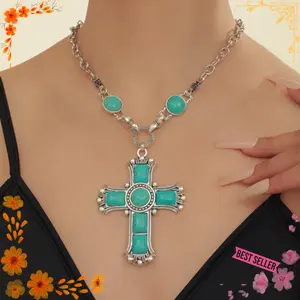 A classic styled turquoise cross pendant silver necklace set with vibrant blue stones, this piece of jewelry adds a strong and elegant touch to any outfit. Ideal for festivals, casual wear or a statement piece in everyday style