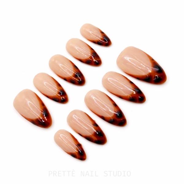 Prettè Nail Studio Amber Muse Press On Nails Medium Almond Nude Tortoise French Tips for Stylish Manicures