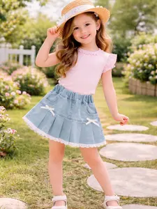 Girls’ pleated denim skirt with bow decoration and lace trim — sweet summer outfit