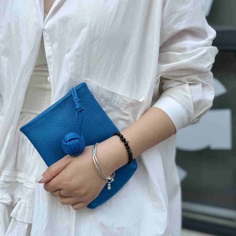 Blue Clutch Bag with Knot Design and Beaded Bracelet for Women's Fashion Accessory