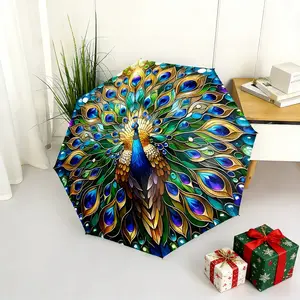 A colorful folding peacock umbrella, with vibrant feather colors, a portable and foldable design, a casual outdoor accessory suitable for all seasons, and the perfect gift for Christmas, Valentine's Day, birthdays, and other holidays.