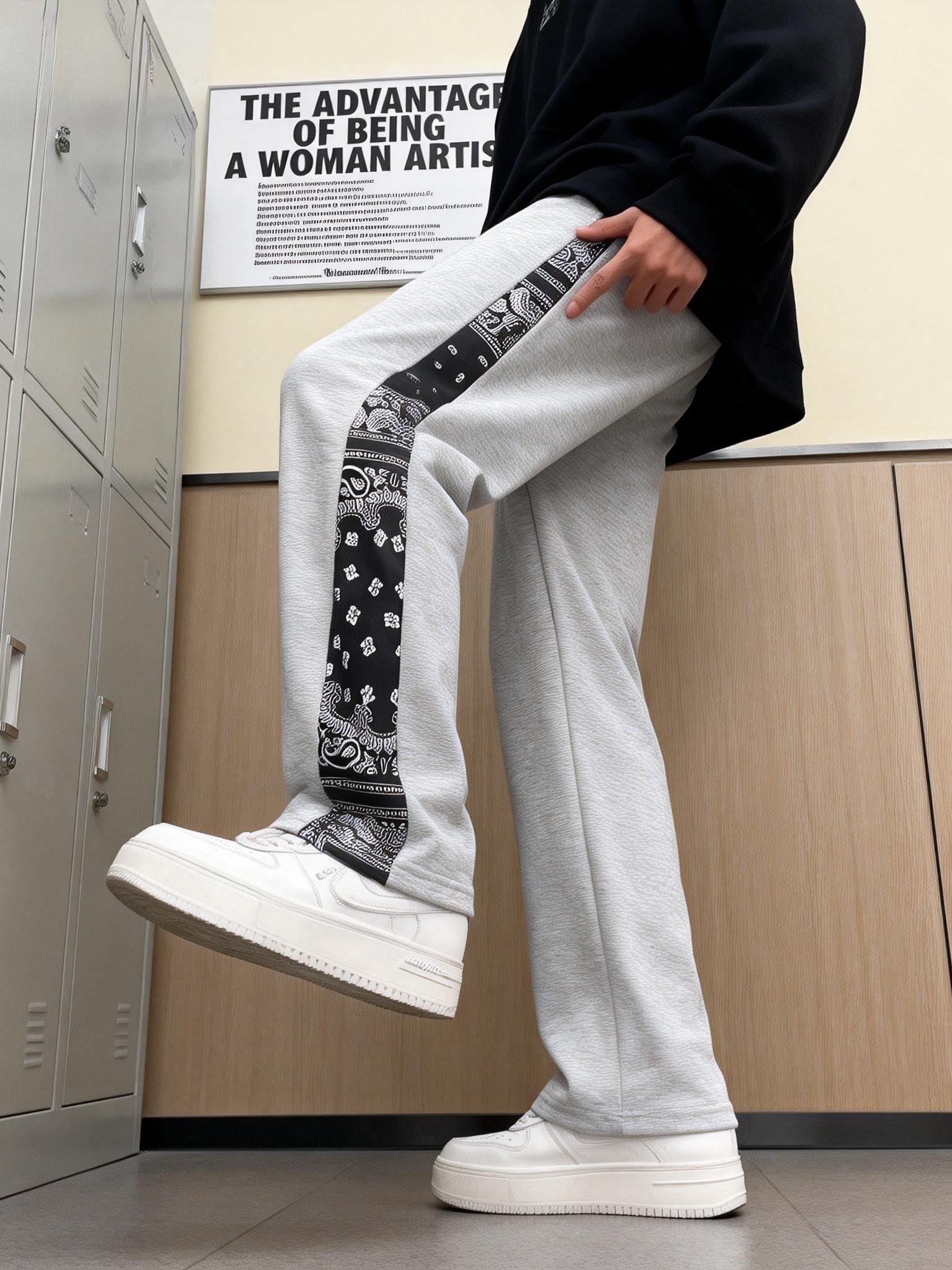 Men’s casual pants featuring an elastic waistband and drawstring design, floral side pattern, side pockets, and slight stretch—comfortable athletic casual pants.