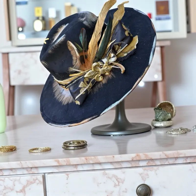 Rusty Peacock Hats Vieux Carré Victory Handcrafted Hat with Black Felt Base Gold Burnish Ribbon Satin Bow Fleur-de-lis Feather Arrangement Adjustable Fit