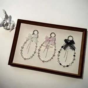 Stylish and elegant lace bow keychain chain, alloy bag pendant, lanyard, goddess pearl crystal mobile phone chain.