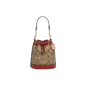 COACH Dempsey 14 Mini Bucket Bag with Dancing Cat Print, Drawstring Closure, Coated Canvas and Pebbled Leather, for Women, Handheld, Shoulder, and Crossbody Carry.
