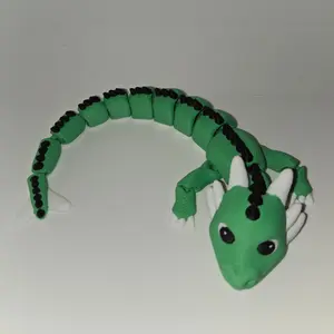 Cute Articulating Fidget Dragon Green Desk Toy with Black Spots and White Accents for Fun and Relaxation