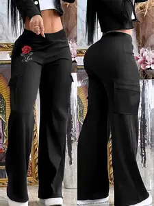 Women's black casual trousers, Pants featuring flap pockets, elastic waistband, and a straight-leg fit. Suitable for spring, summer, and autumn wear.  Workwear style.