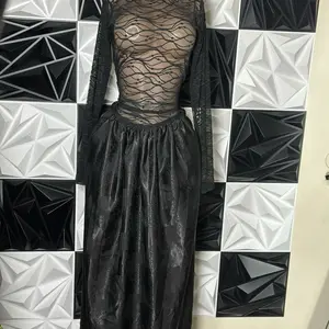 Elegant Black Mesh Top with Long Sleeves and Flowing Skirt for a Chic Look Womenswear