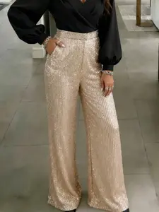Women's trendy wide-leg trousers with a glossy finish, high-waisted design and flowing fabric, perfect for parties and evening events. Elegant, stylish, and versatile.