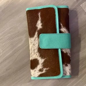 Turquoise Cowhide Wallet with Brown and White Cowhide Accents and Teal Leather Trim