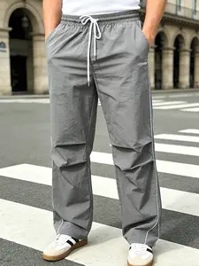 Men's Gray Parachute Pants Activewear - Elastic Drawstring Waist with Side Piping, "captive" Slogan Print, Loose Wide Leg Fit for Street Style, Outdoor Activities & Casual Wear
