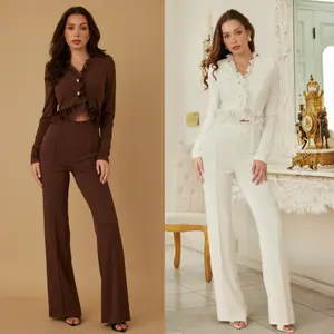 RUFFLE CARDIGAN JUMPSUIT - WAVY RUFFLE TRIM - TWO BUTTON UP DETAIL - LONG SLEEVE - OPEN SLIT DETAIL ON STOMACH AREA - ZIPPER ON THE BACK