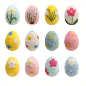 A set of 12 felt Easter eggs for large party decorations, perfect for table centerpieces and basket decorations. These large pastel faux felt eggs are perfect for spring crafts, tree decorations