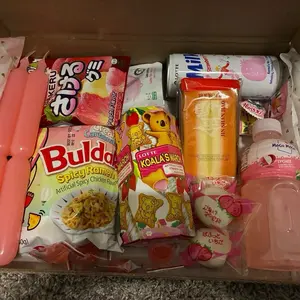 Pretty and Pink Box - Assorted Snacks & Drinks Including Spicy Ramen, Koala crème cookies, Strawberry Soda, and more!