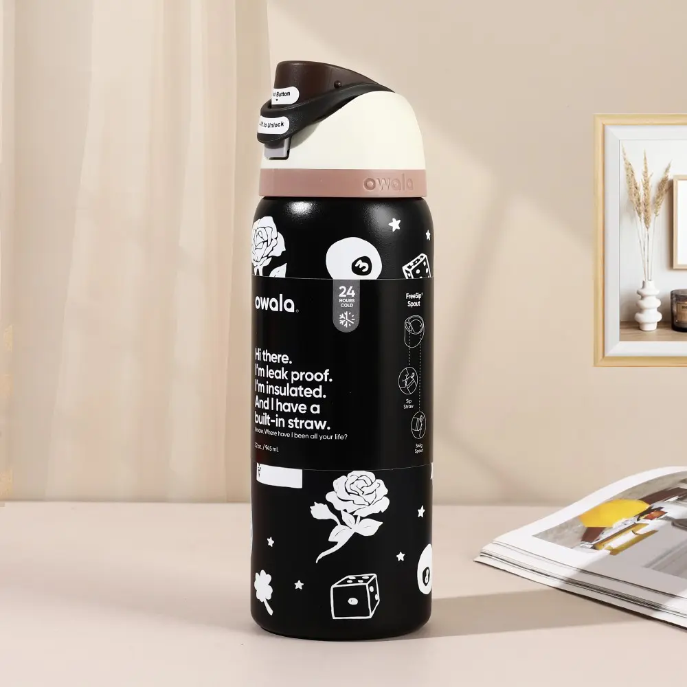 Owala FreeSip 32oz Stainless Steel Insulated Water Bottle in "Black Card"—"Good Luck Cowboy" Special Edition. Featuring a leak-proof seal design, it is suitable for cold beverages and includes a convenient carry loop for easy portability.