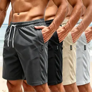Men’s slim-fit shorts with letter appliqué patches, drawstring waist, stretch pockets, breathable fabric; regular fit casual fashion shorts—men’s summer everyday bottoms.