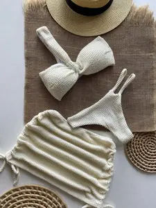 Beige three-piece swimsuit with ruffled skirt and one shoulder bra
