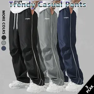 Loose Fit Men's Trousers with Grey Side Stripes and Gold Trim Stripes Comfortable Design Sports and Casual Style Bottoms Sweatpants Fitness Wear Fashionable and Versatile