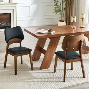 2 walnut colored solid wood dining chairs, with black PU soft packaging on the backrest and seat cushion, hollowed out design backrest, for home dining chairs