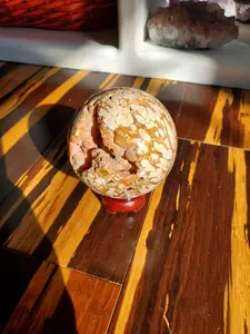 Natural polished Amber Calcite sphere with druzy